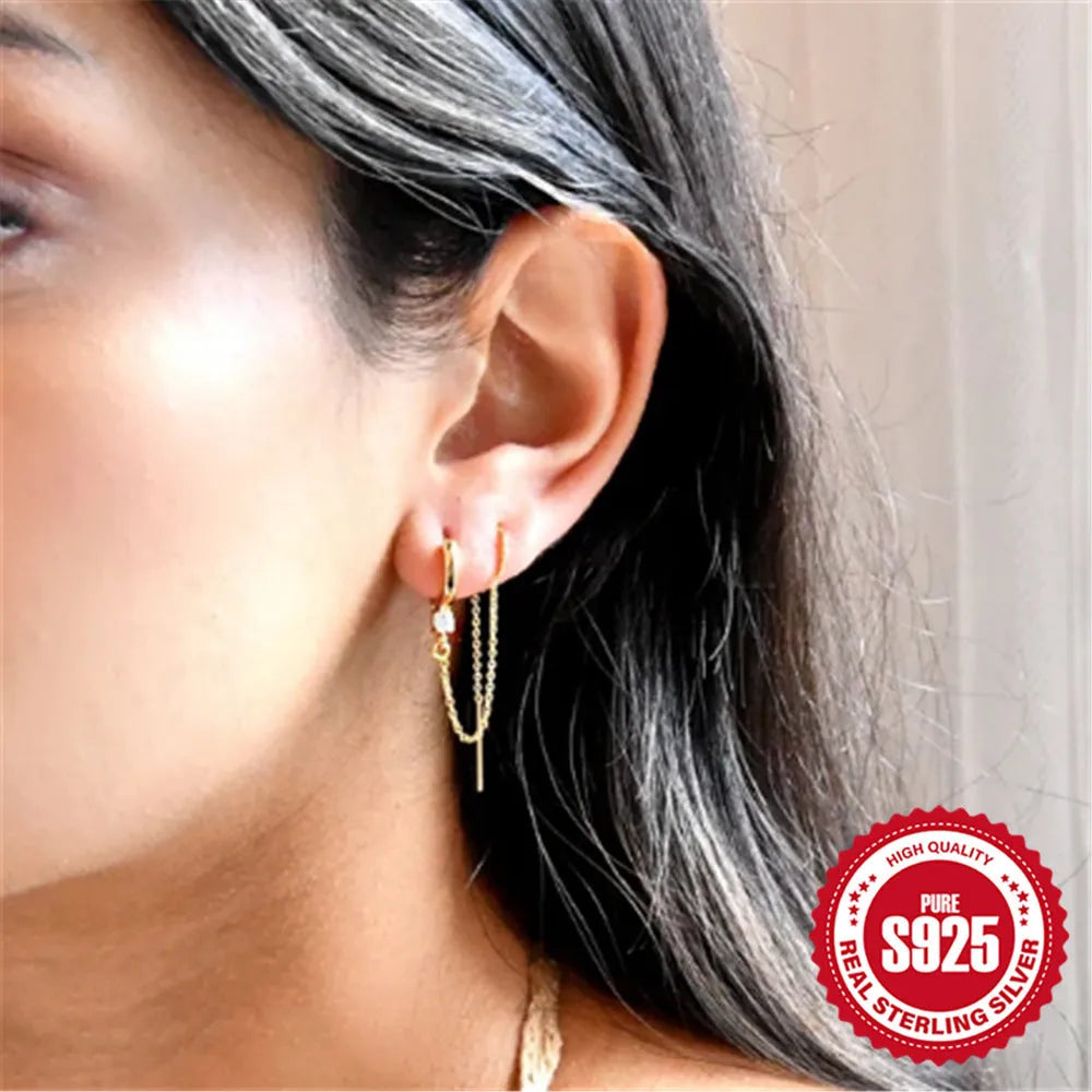 S925 sterling silver flower-shaped earring with a dangling chain tassel in a gold colour finish.