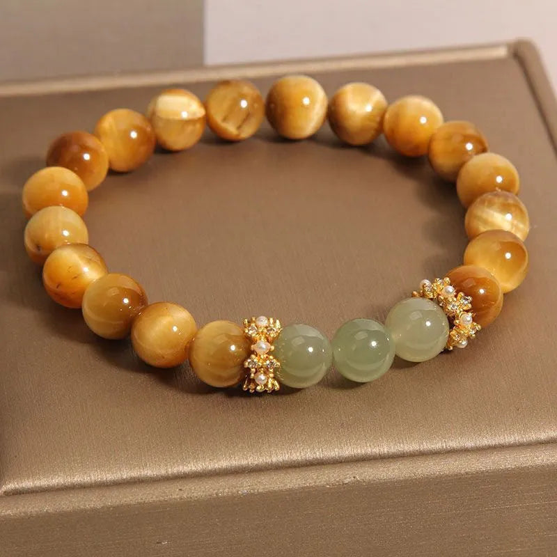 Natural yellow tiger's eye stone bracelet showing golden gourd, bamboo joint, and lace pattern variations
