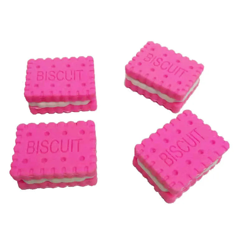 Sandwich biscuit shape eraser in brown, pink, green, or purple colour on a cake.