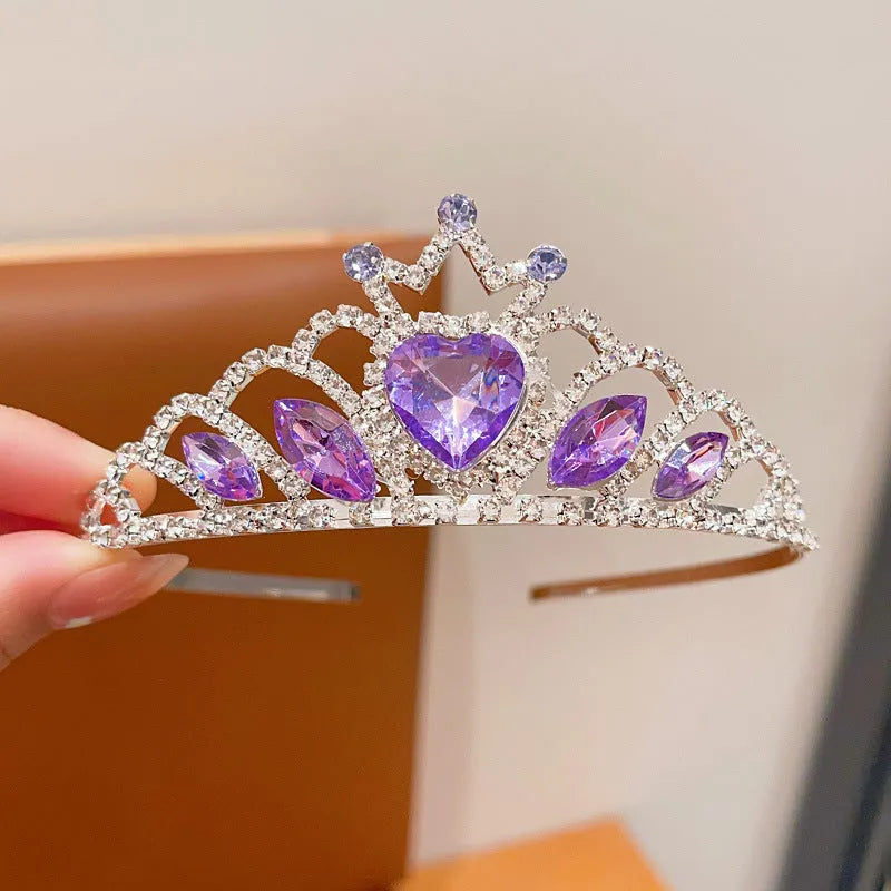 Girl's shiny metal headband with a crystal crown design in pink, light blue, and light purple colours.