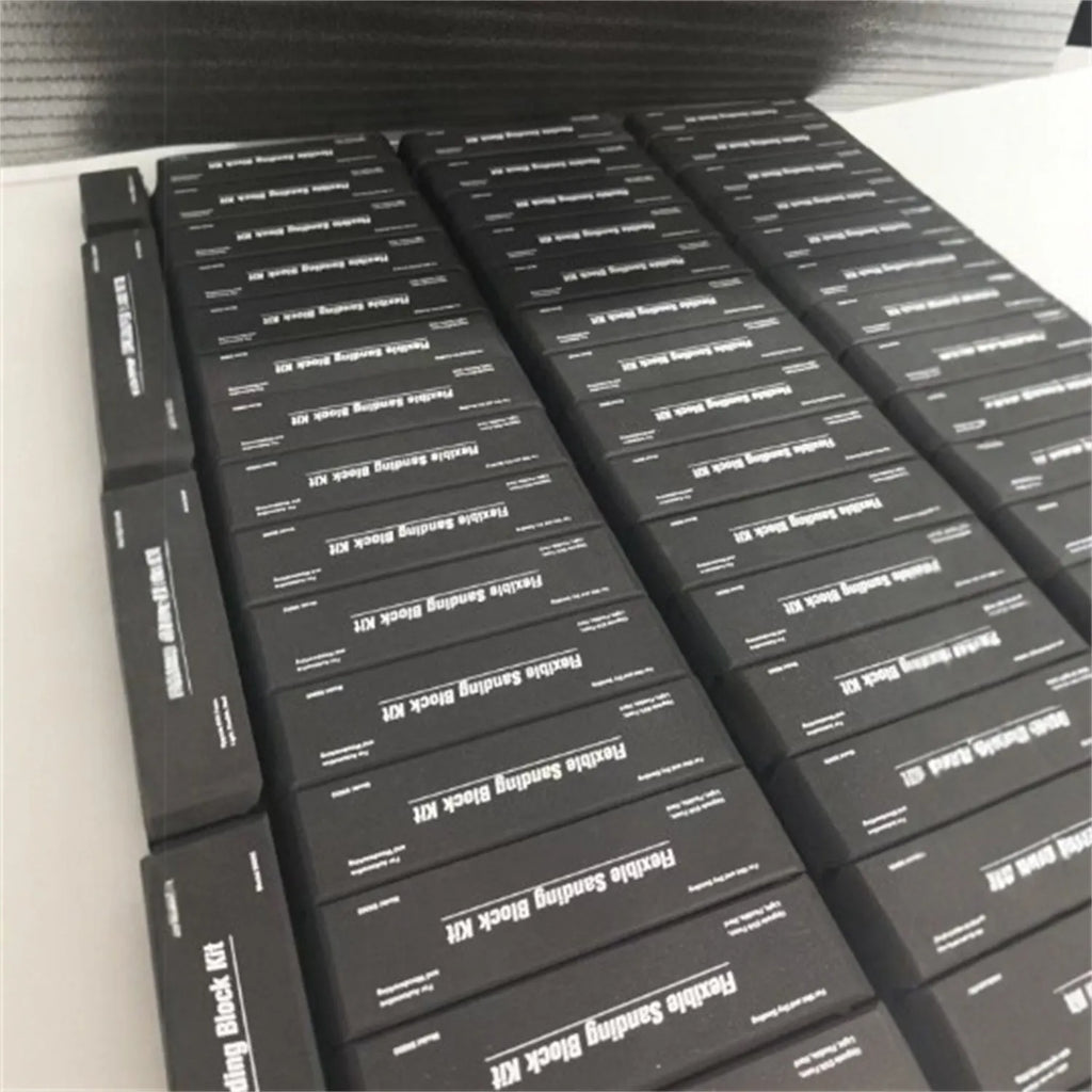 Seven black EVA frosted building blocks with metal connectors for construction and modelling