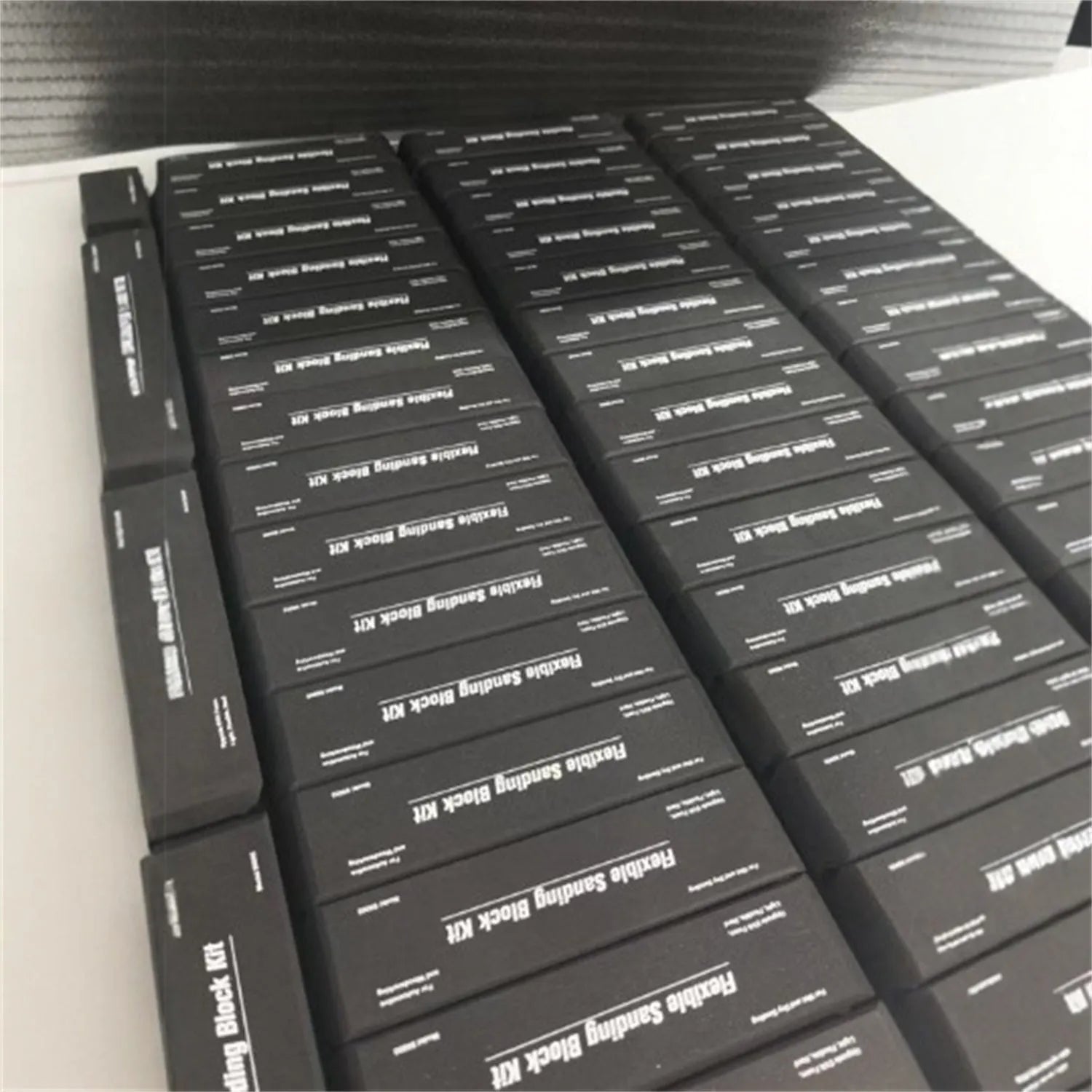 Seven black EVA frosted building blocks with metal connectors for construction and modelling
