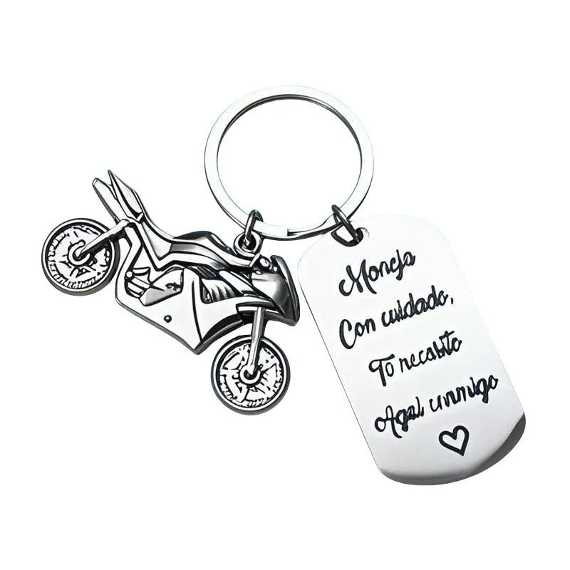 Stainless steel motorcycle-themed keychain with charm and a red flannel storage pouch.