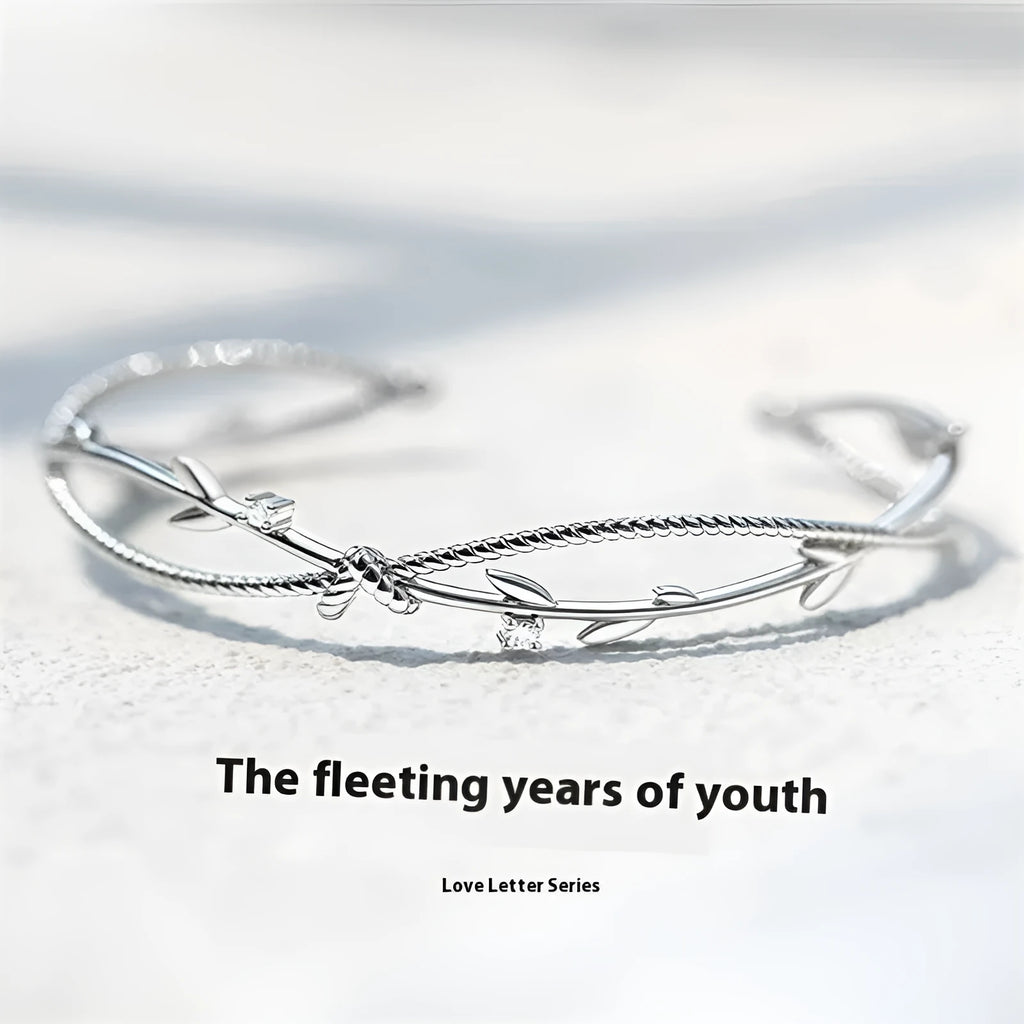 Copper tree branch sprout bracelet with cross twisted design in white gold electroplated finish