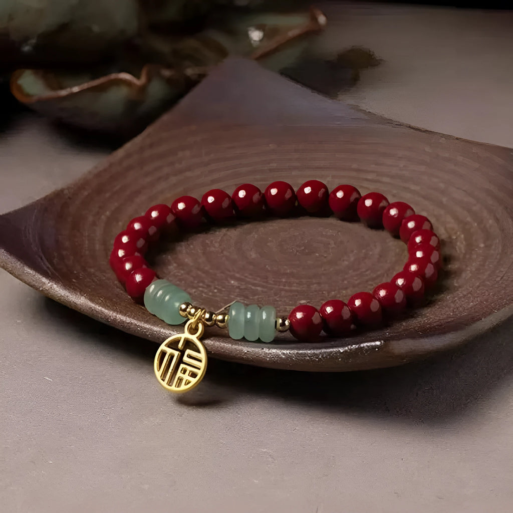 Handmade gold cinnabar wave bracelet showing genuine stone and copper bead construction in national style design