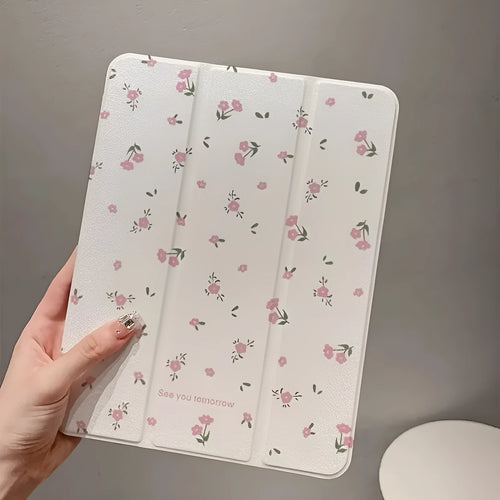Transparent tri-fold Apple iPad case with cartoon floral print showing magnetic stand function.