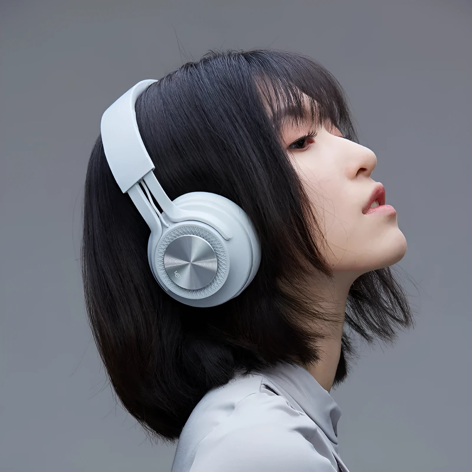 Sports wireless Bluetooth headset in red, grey, green, or black colours.
