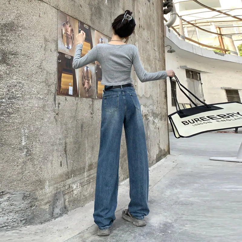 Women's high-waist retro blue straight-leg jeans on a hanger, showing the classic fit.