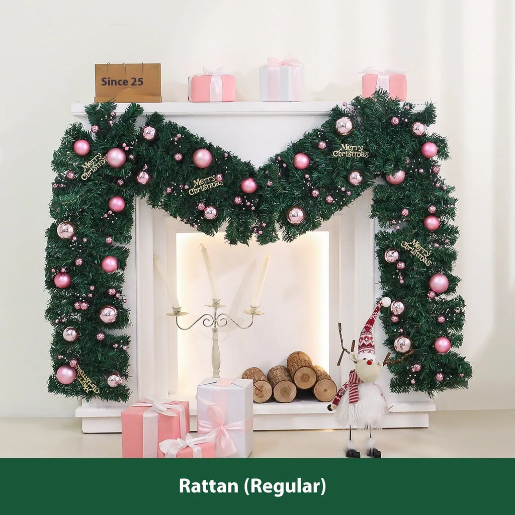 2.7 metre long pink Christmas rattan decoration with 240 decorative heads draped on a mantelpiece