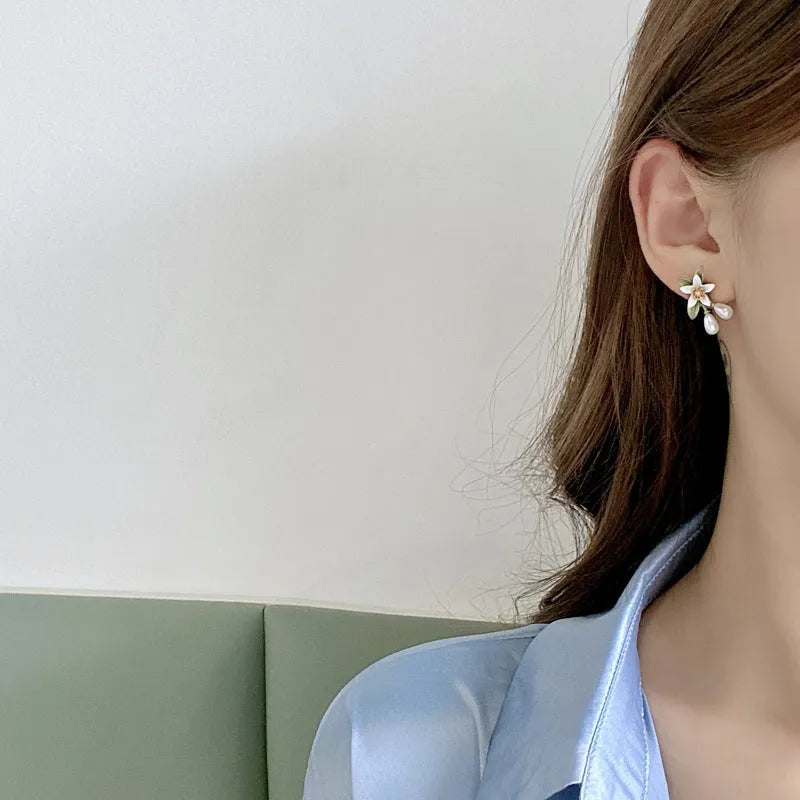 Women's alloy flower earrings showing camellia stud and ear clip options with personality contrast colour
