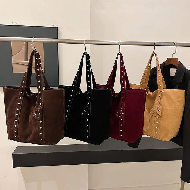 Black PU leather horizontal tote bag with double shoulder straps, showing outer sandwich pocket.