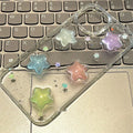 Three-dimensional five-pointed star glitter epoxy phone case for iPhone 15 Pro
