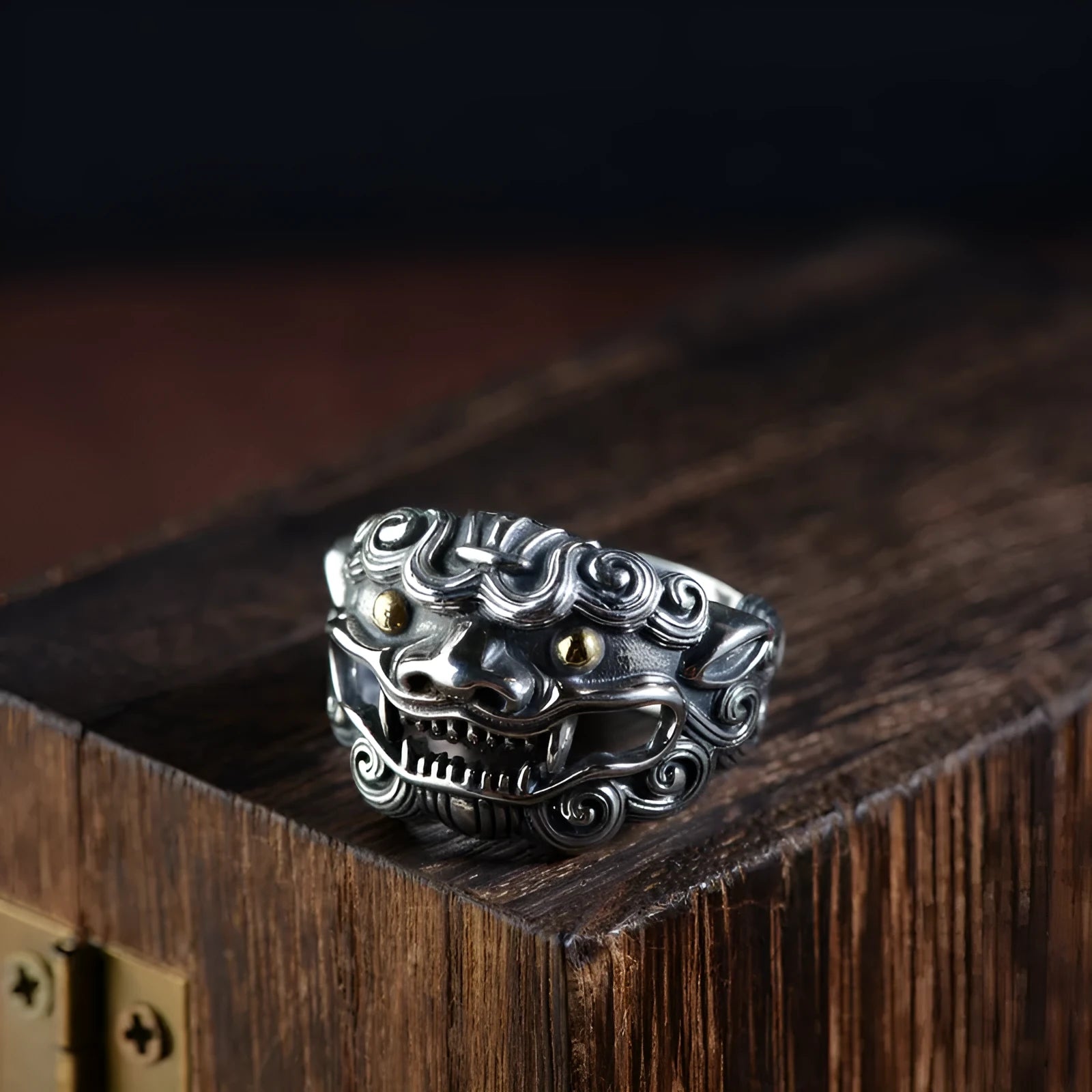 Silver open-ended ring with a raised Domineering Jibeast animal zodiac pattern.