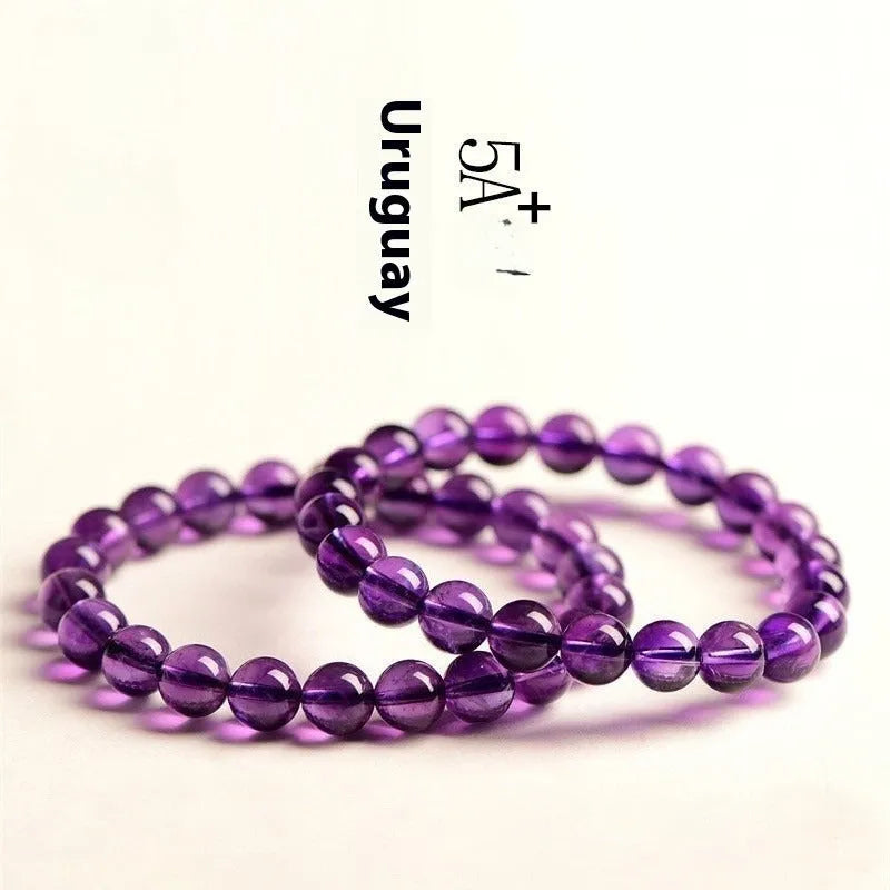 Natural amethyst Uruguay bracelet with polished purple beads, shown in single circle and triple ring designs.