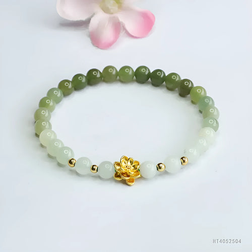 Hand-woven Chinese jade bracelet with water-gradient colour pattern and flower design