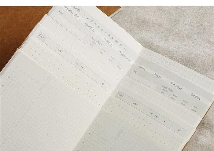 Diary refill inner core showing saddle stitch binding and 11x21cm dimensions