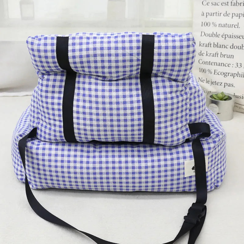Grey and blue plaid cloth dog bed designed for car travel, shown in small and large sizes.
