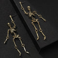 Exaggerated skull frame earrings in antique silver, zinc alloy electroplated finish, unisex design with hook fastening on white background