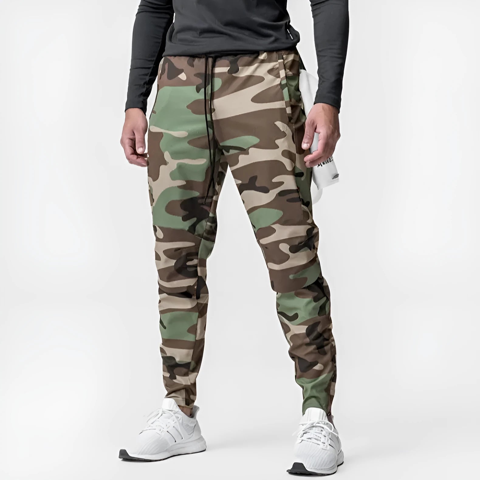 Men's grey ankle-tied loose fitness running trousers on a hanger.