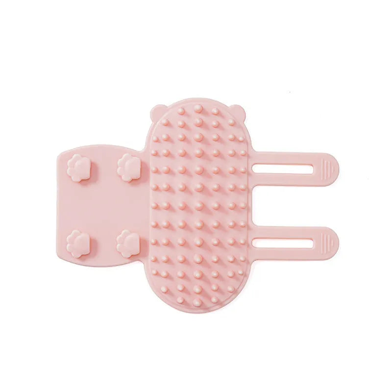 Silicone cat grooming comb with adjustable strap mounted on a furniture leg