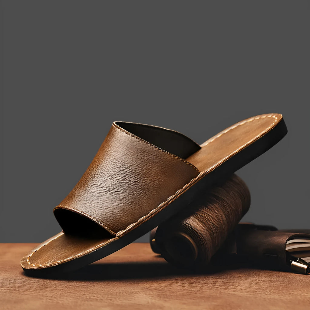 Men's brown leather casual sandals with a textured rubber sole on a neutral background.