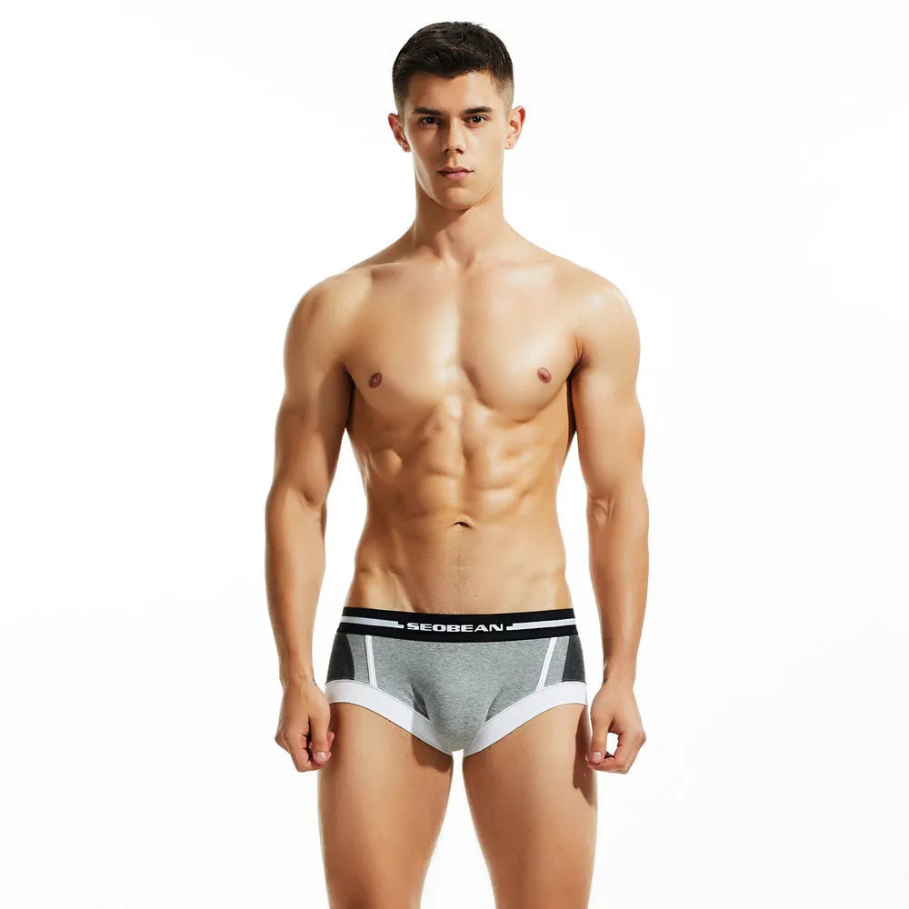 Men's cotton boxers in red, dark blue, and light grey colours showing low waist hip lifting design