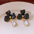 Floral pendant earrings in alloy with dripping oil finish, silver needle posts, Golden-white or Golden-black