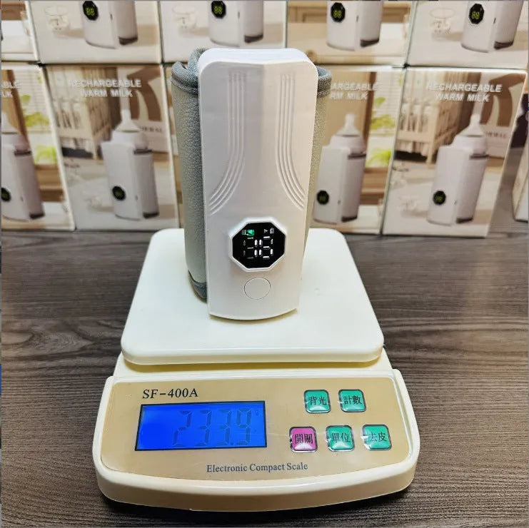 Grey and white car charger electric milk warmer for baby bottles on a 12V DC socket.
