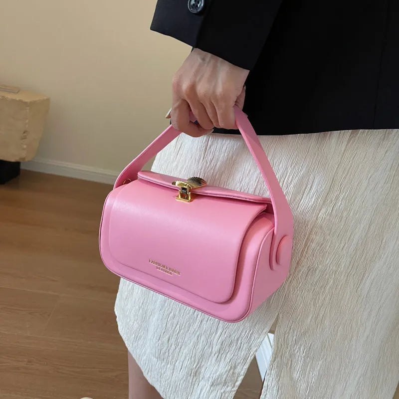 A personalised women's PU messenger bag in beige with a monogram letter and stitching detail.