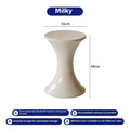 A plastic hourglass-style shoe changing stool in one of five available colours.