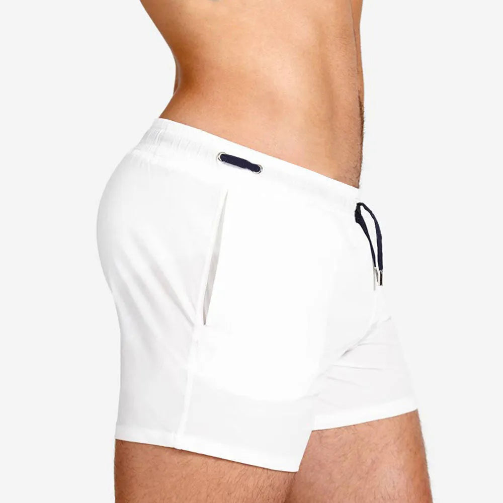 Polyester mesh-lined sports shorts in solid colours for swimming and fitness.
