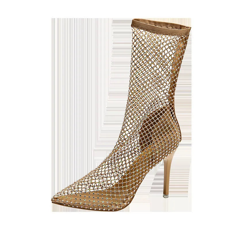 Gold high heel sandals with pointed toes, stiletto heels, and a mesh upper.