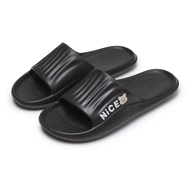 Adult unisex EVA cartoon pattern flip flop slippers in black, shown from above.