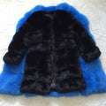 Women's long artificial fur coat in a range of colours on a hanger.