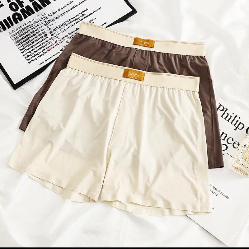 Men's solid colour ice silk underwear with a loose fit and mid waistband on a neutral background.