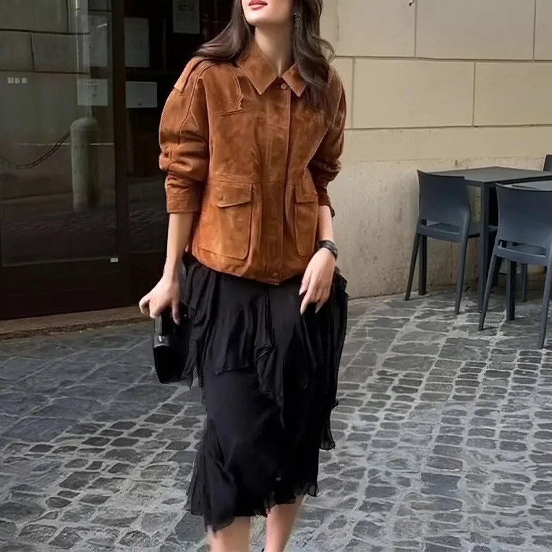 Women's brown suede-look polyester coat with regular sleeves on a hanger.