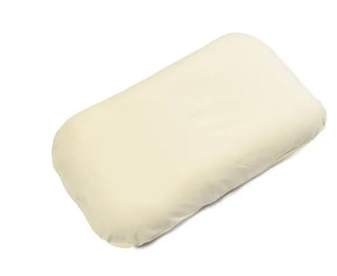 Beige portable baby nest cot crib for infants on a neutral background