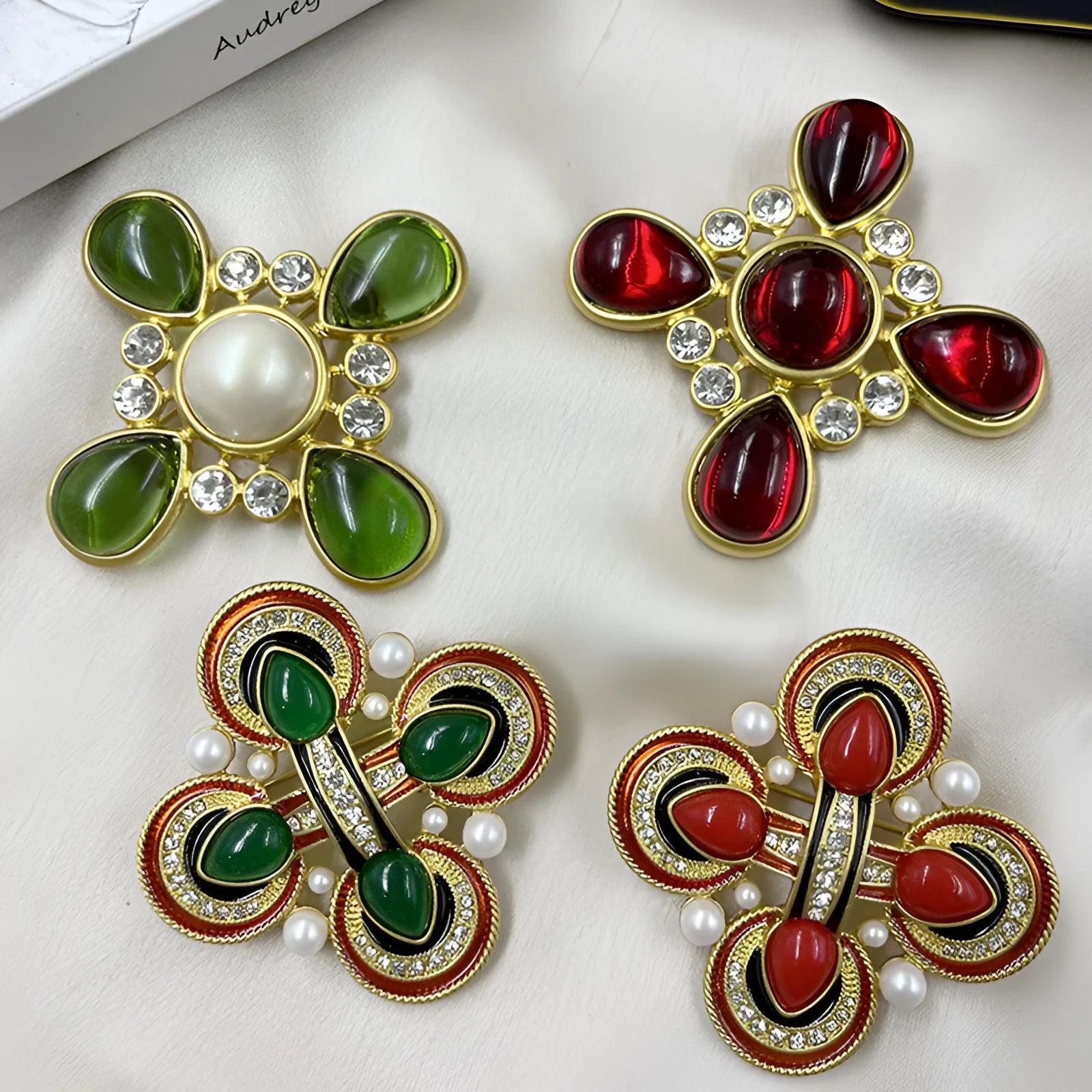 Close-up of a vintage medieval baroque cross brooch in zinc alloy with crystal accents, showing intricate detail.