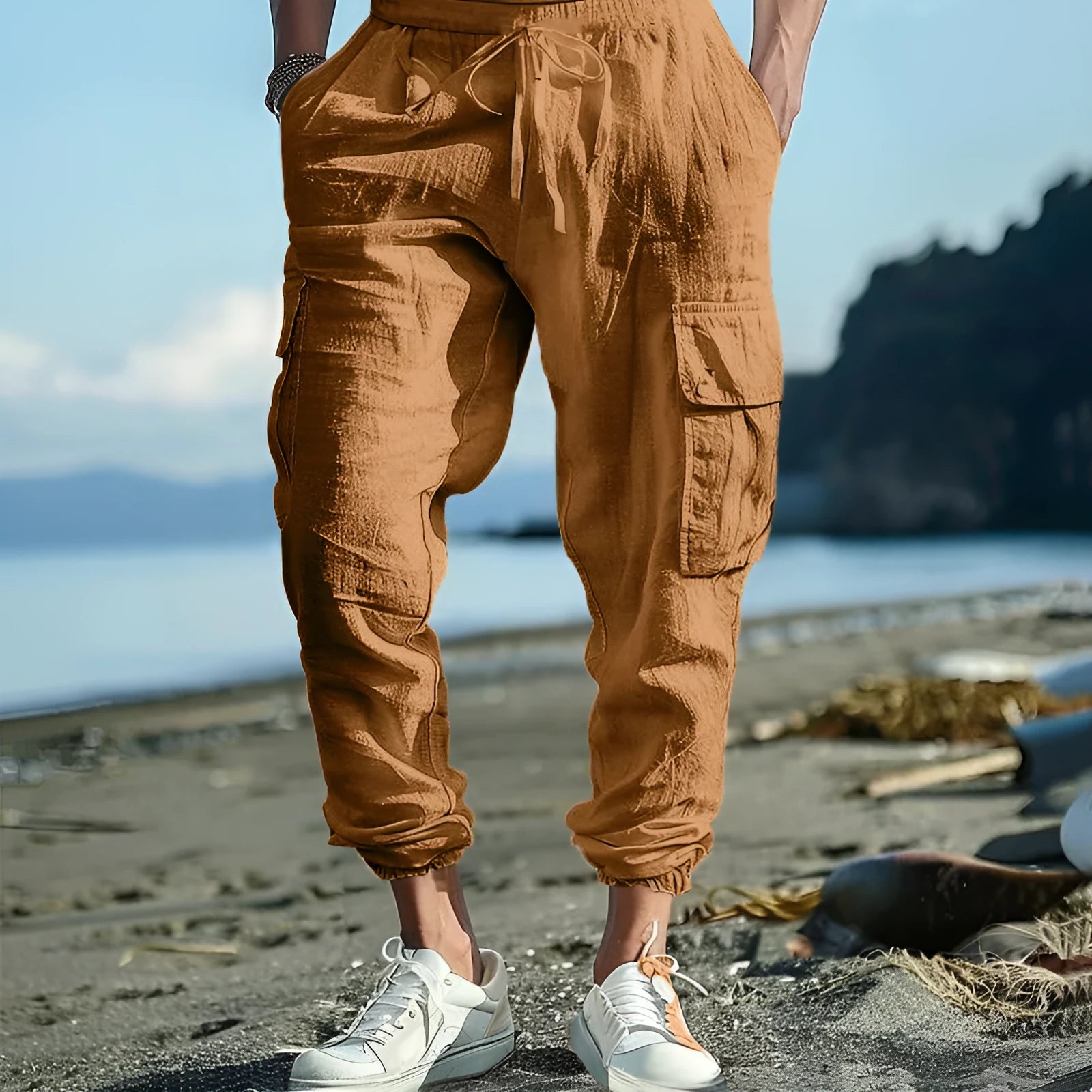 Men's linen casual trousers with ankle-tied cuffs and multiple pockets in a solid colour.