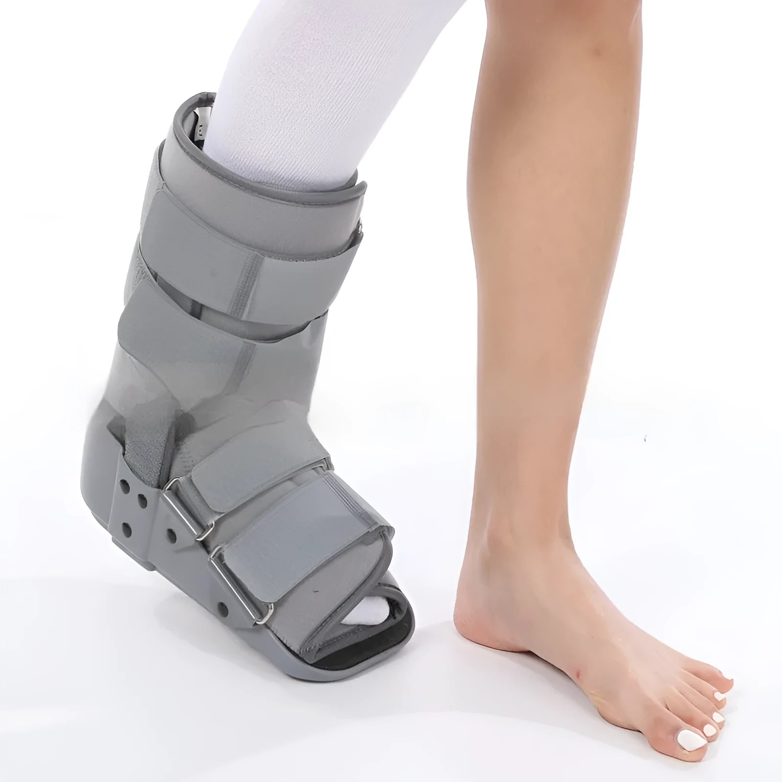 Grey and black Achilles tendon rehabilitation boot with adjustable straps and rocker sole for walking support.