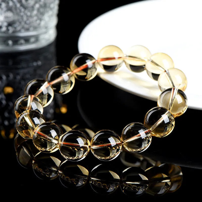 Natural citrine scattered beads ball bracelet showing golden polished stones on a wrist, available in 7A and 6A grades.