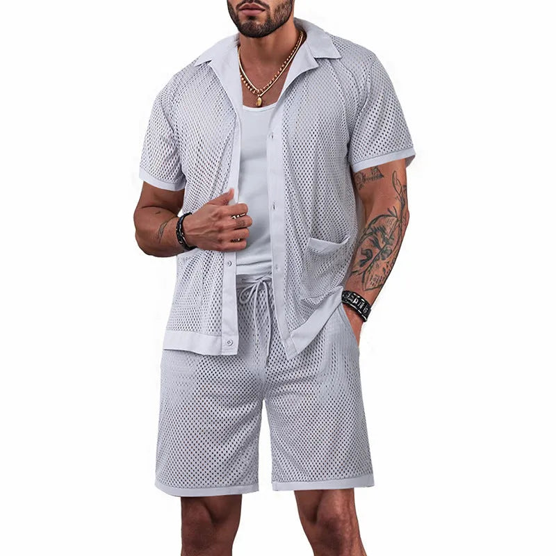 Women's light blue see-through short sleeve cardigan and matching shorts beach set laid flat.