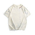Grey loose fit t-shirt with an all-over tie dye print and short sleeves.
