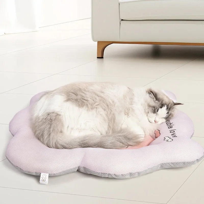 Green pet cooling mat for a medium-sized dog resting on an ice silk surface.