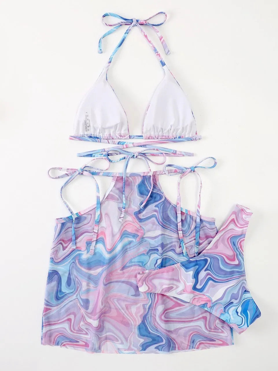 Lavender 3-piece women's bikini set with sheer beach skirt on display
