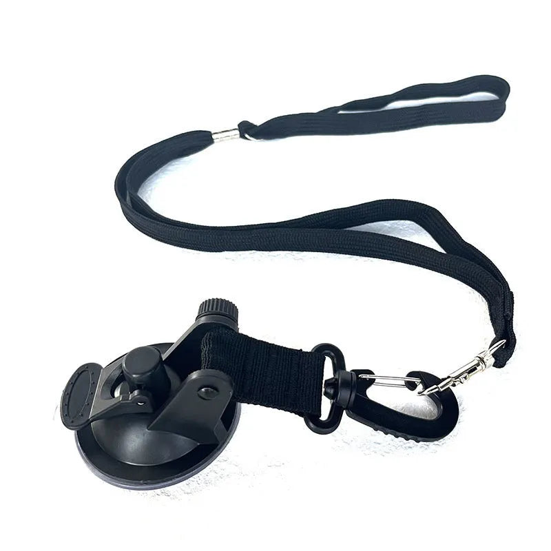 Pet bath restraint kit with four blue suction cup handcuffs and a connecting rope on bathroom tiles.