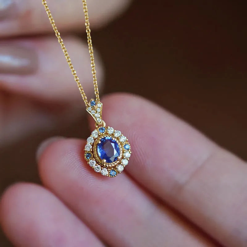 Yellow gold colour necklace with a mixed gemstone pendant on an adjustable copper box chain.