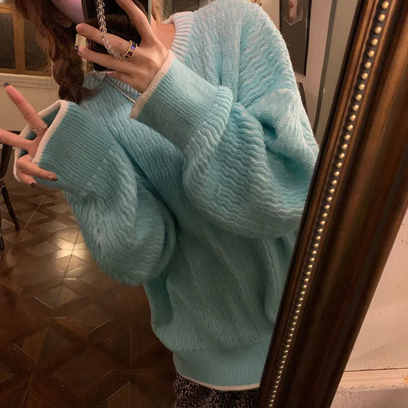 Women's loose retro pullover sweater in lake blue, shown in a casual setting.