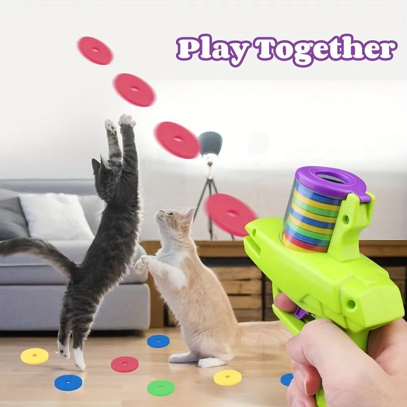 Green and purple durable plastic cat toy launcher with foam discs for battery-free interactive play