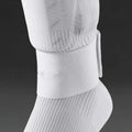 Silicone rubber shin guard fixing strap in red, shown stretched
